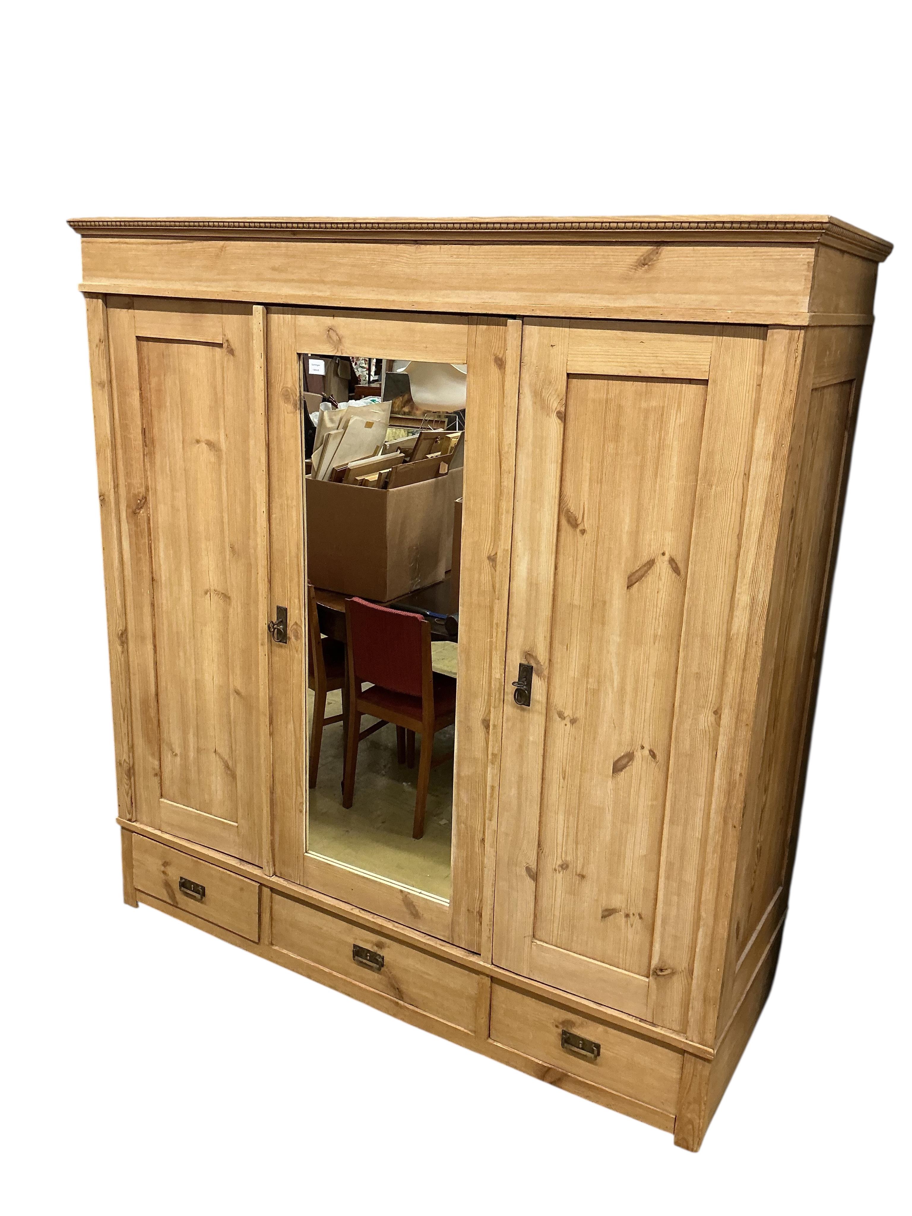 A 19th century East European mirrored pine wardrobe, width 182cm, depth 68cm, height 196cm